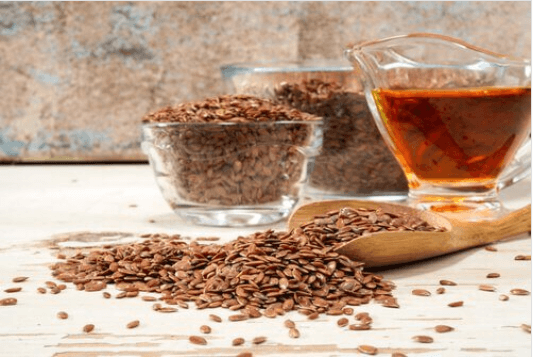 Νερό από λιναρόσπορο - Μπολ με λιναρόσπορο και ποτήρι με νερό λιναρόσπορου